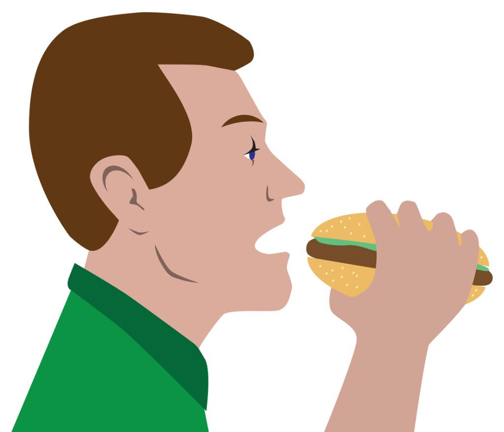 A imagem mostra um homem com a boca aberta a morder um hamburguer